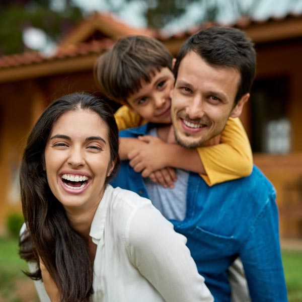 laughing family of three